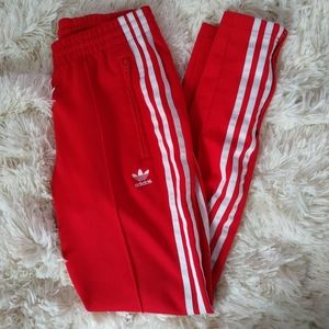 red adidas track pants